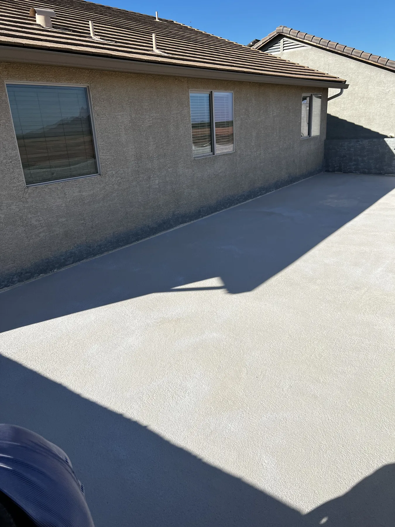 Completed bright roof coating application by EZ-Koatings